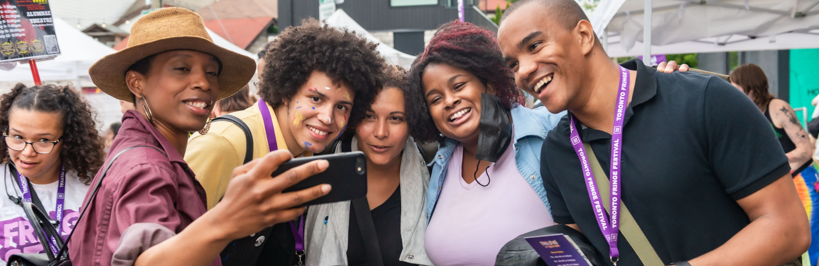 Artists take a selfie together at the Fringe Patio