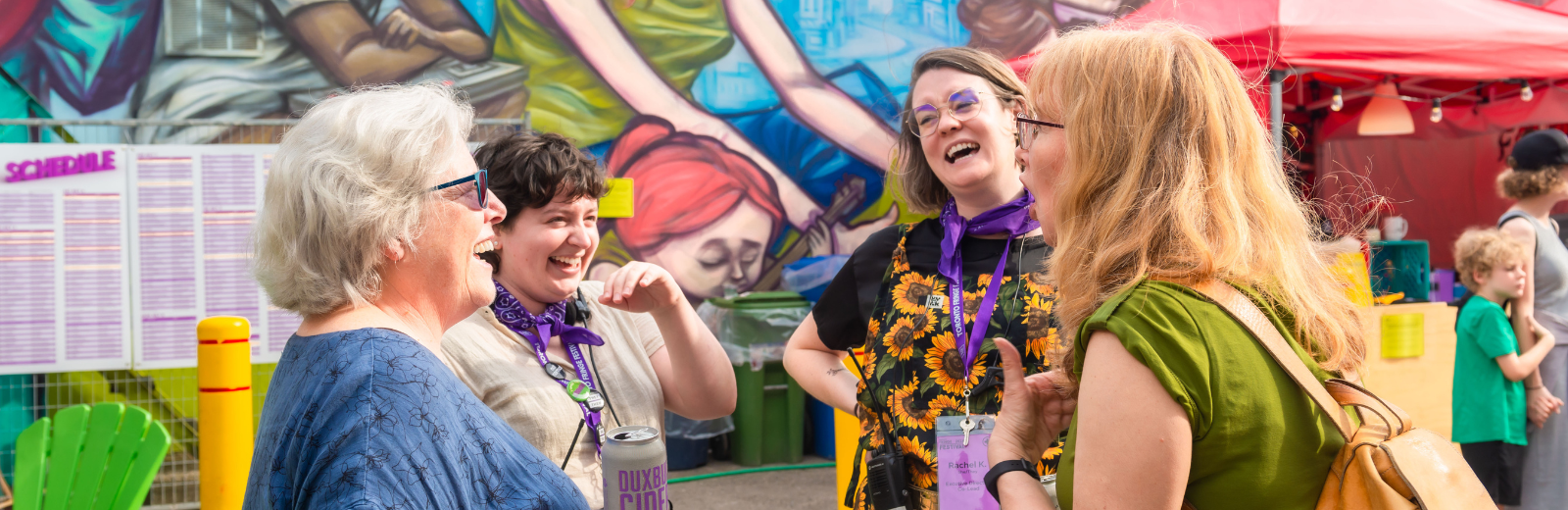 Donors laugh together at the Fringe Patio