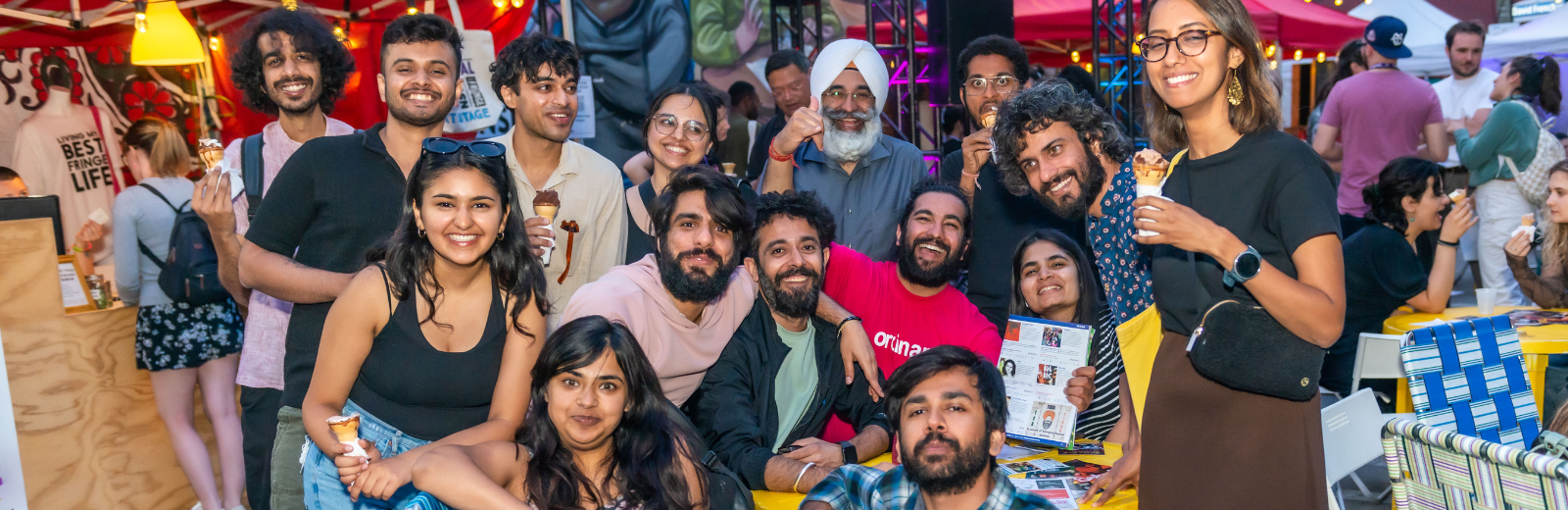 Family and friends of a Fringe artist gather around for a big group photo